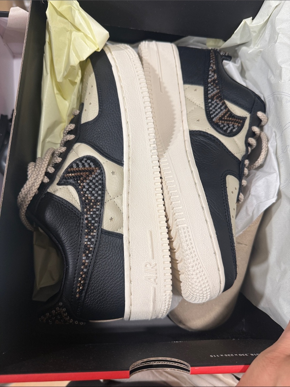 Nike Low-Top Sneakers in Black and Cream with Patterned Swoosh